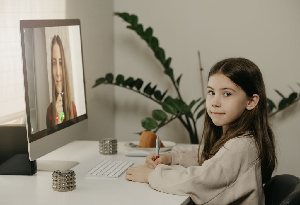 distance learning young girl with long hair studying remotely