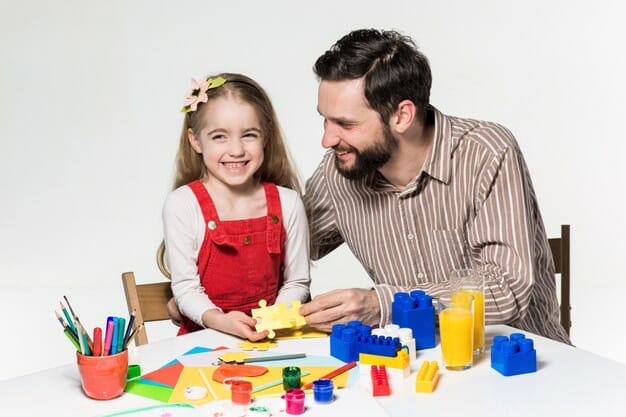 Father daughter playing educational games together