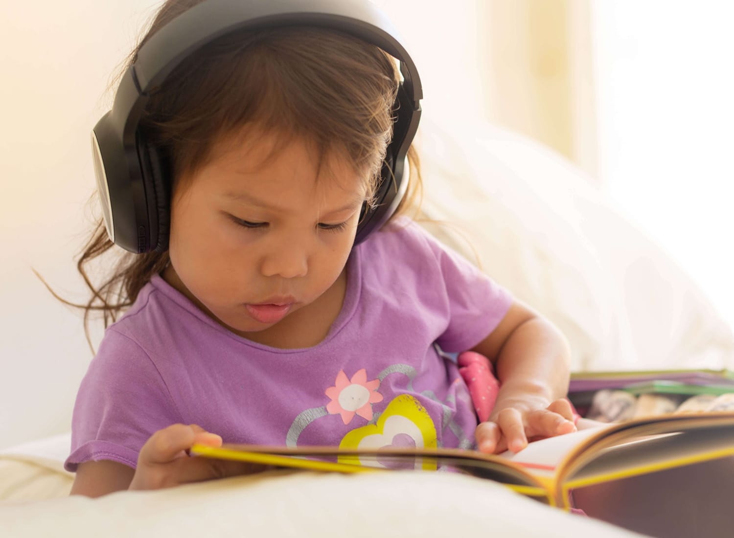 Baby read book with occupational therapy services