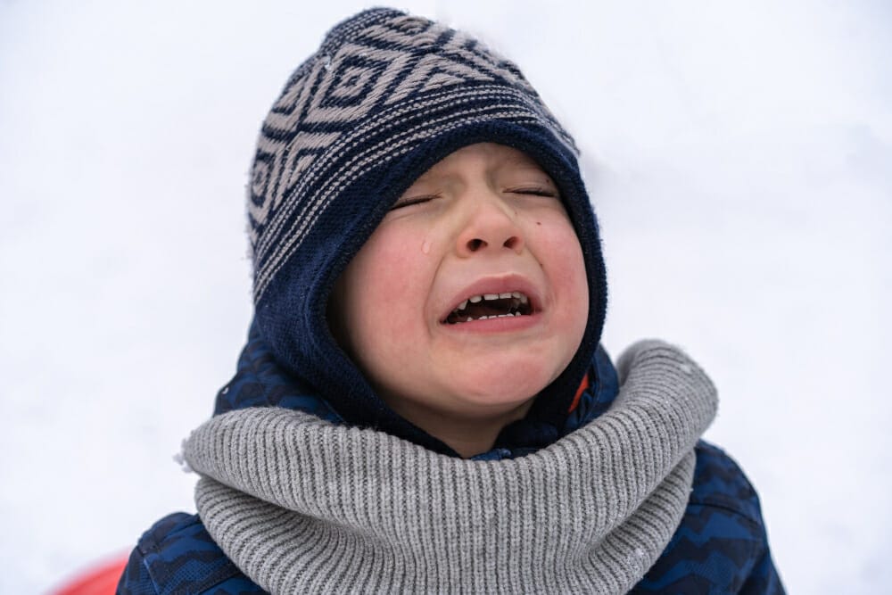 child upset and not wanting to wear winter clothes