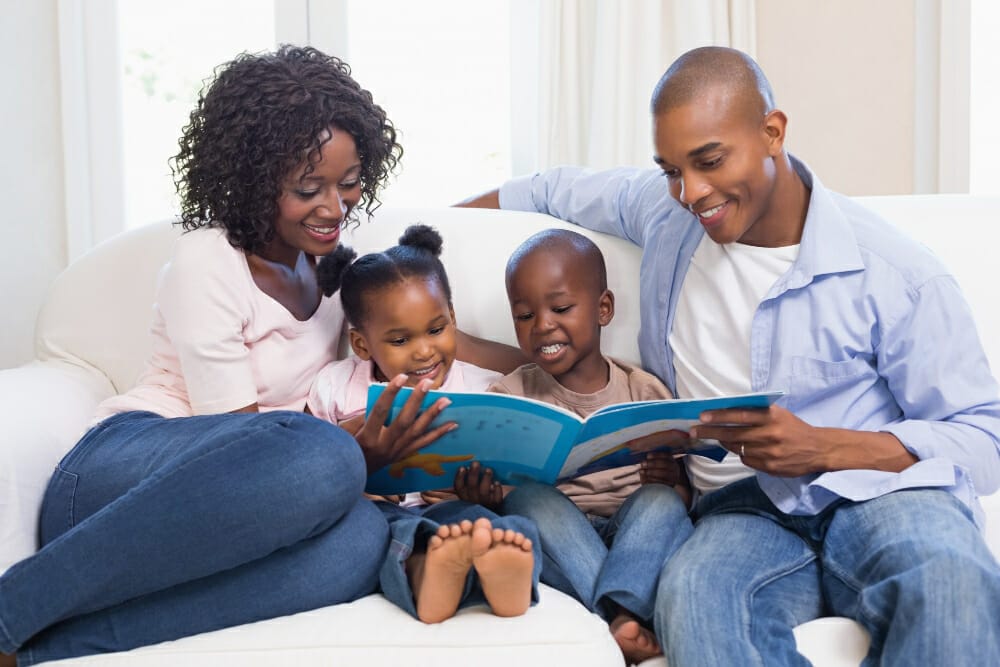 Family working on literacy skills with child