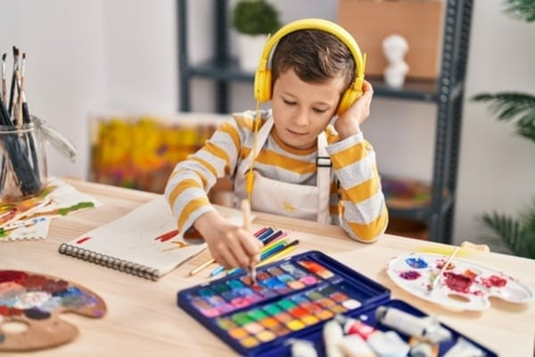 child using audio tools in art project
